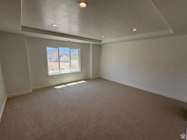 306 E 1480 N Unit 44, Salem, UT 84653 - unfurnished room featuring a tray ceiling, light colored carpet, a textured ceiling, and recessed lighting