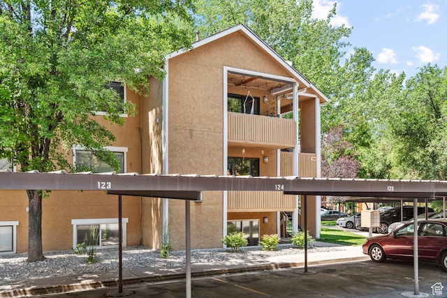 1289 E Ridge Meadow Ln S Unit 8S, Cottonwood Heights, UT 84047 - view of building exterior featuring covered parking