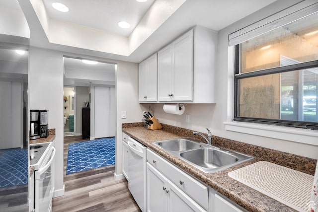 1289 E Ridge Meadow Ln S Unit 8S, Cottonwood Heights, UT 84047 - kitchen featuring white appliances, healthy amount of natural light, light wood-style flooring, white cabinets, and recessed lighting