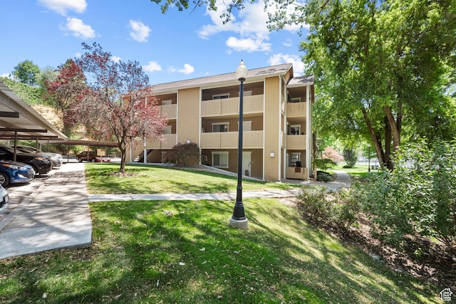 1289 E Ridge Meadow Ln S Unit 8S, Cottonwood Heights, UT 84047 - view of building exterior with covered parking