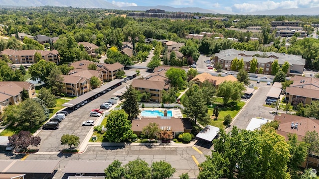 1289 E Ridge Meadow Ln S Unit 8S, Cottonwood Heights, UT 84047 - aerial view of residential area with a mountain backdrop and a pool area
