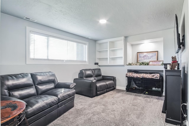 254 W 1600 N, Harrisville, UT 84404 - carpeted living room with a textured ceiling and a fireplace with flush hearth