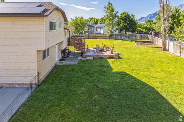 254 W 1600 N, Harrisville, UT 84404 - fenced backyard with a deck with mountain view and a patio