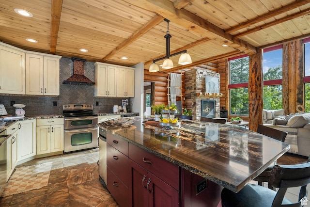 8656 N W Dr E, Eagle Mountain, UT 84005 - kitchen featuring wall chimney exhaust hood, double oven range, a wooden ceiling with exposed beams, open floor plan, and rustic walls