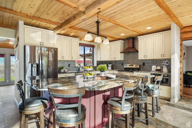 8656 N W Dr E, Eagle Mountain, UT 84005 - kitchen featuring wall chimney range hood, stainless steel appliances, a wood ceiling with exposed beams, healthy amount of natural light, and tasteful backsplash