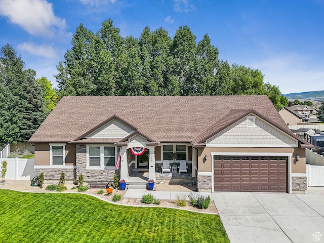 918 E 120 S, Heber City, UT 84032 - craftsman inspired home featuring stone siding, an attached garage, concrete driveway, stucco siding, and a shingled roof