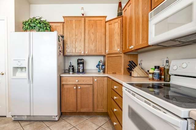 674 E Free Land Ave S, Midvale, UT 84047 - kitchen with white appliances, light countertops, light tile patterned flooring, and brown cabinets