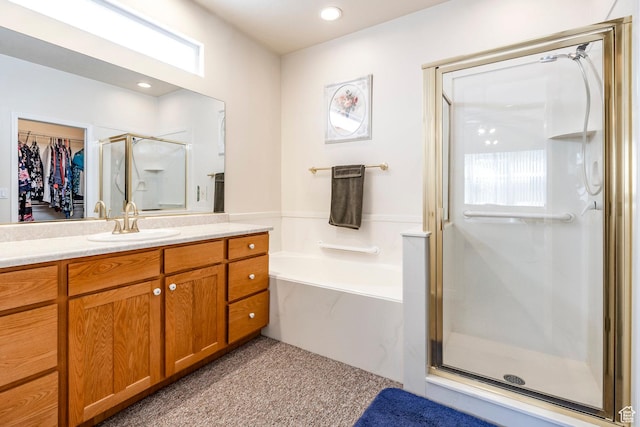 674 E Free Land Ave S, Midvale, UT 84047 - full bathroom featuring vanity, a stall shower, a garden tub, and healthy amount of natural light