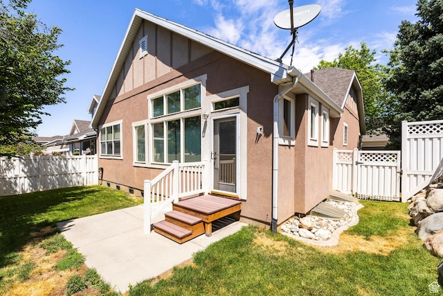 674 E Free Land Ave S, Midvale, UT 84047 - rear view of property featuring stucco siding and a patio
