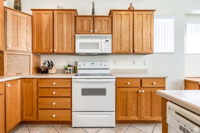 674 E Free Land Ave S, Midvale, UT 84047 - kitchen featuring white appliances, light tile patterned flooring, and light countertops