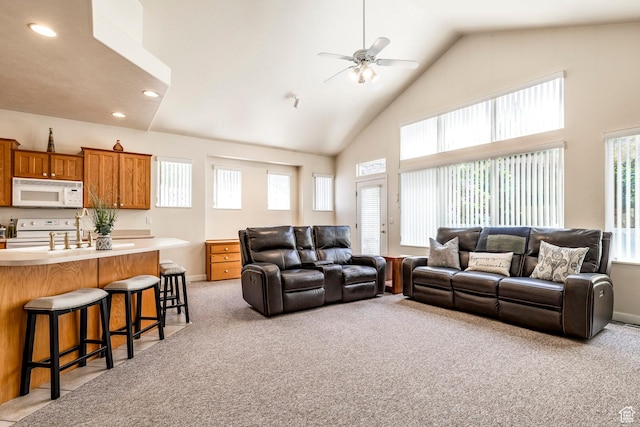 674 E Free Land Ave S, Midvale, UT 84047 - living room featuring high vaulted ceiling, a ceiling fan, light colored carpet, and recessed lighting