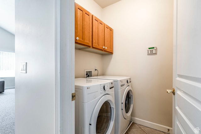 674 E Free Land Ave S, Midvale, UT 84047 - washroom with washer and dryer, cabinet space, and light tile patterned floors