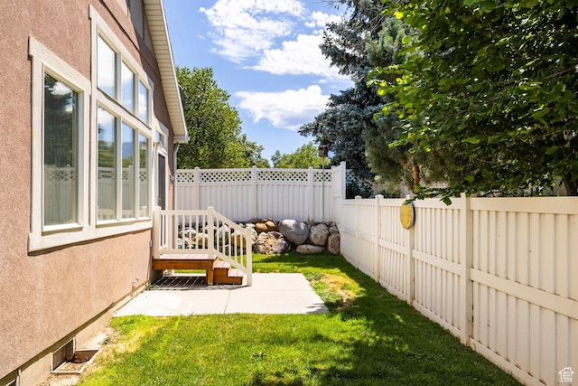 674 E Free Land Ave S, Midvale, UT 84047 - fenced backyard with a patio area