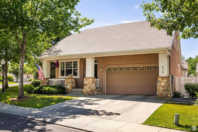 674 E Free Land Ave S, Midvale, UT 84047 - view of front facade with stone siding, a porch, a garage, stucco siding, and concrete driveway