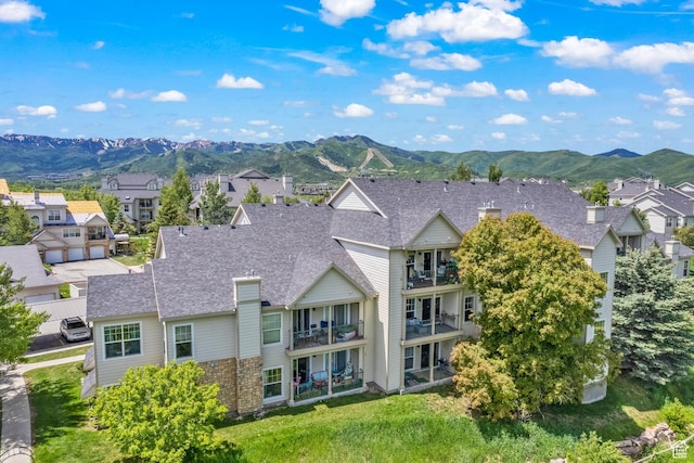 900 Bitner Rd Unit K25, Park City, UT 84098 - back of property featuring a residential view, a mountain view, a balcony, and roof with shingles