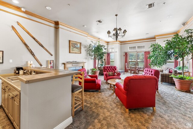900 Bitner Rd Unit K25, Park City, UT 84098 - carpeted living room featuring crown molding, a chandelier, a fireplace, and recessed lighting