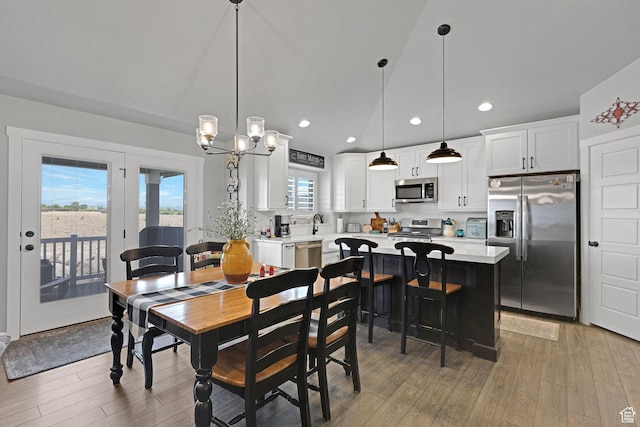 1792 W Norway Spruce Dr, Layton, UT 84041 - dining room with recessed lighting, light wood-style flooring, and a chandelier