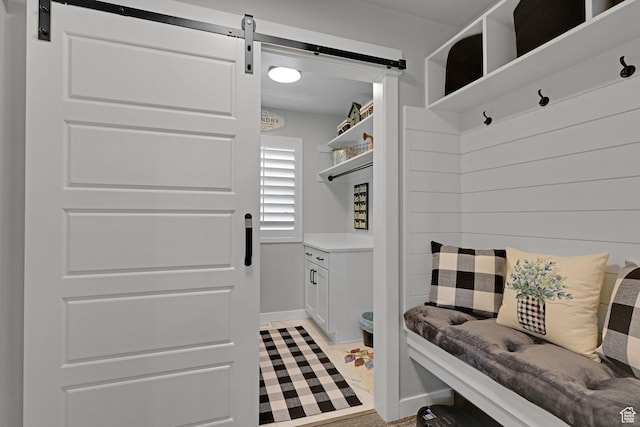 1792 W Norway Spruce Dr, Layton, UT 84041 - mudroom with a barn door and light tile patterned flooring