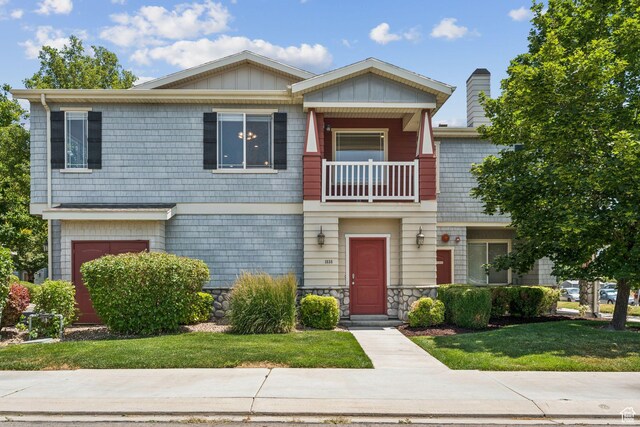 1535 W 80 S, Pleasant Grove, UT 84062 - view of property featuring a balcony, a front yard, and a chimney