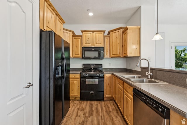 1535 W 80 S, Pleasant Grove, UT 84062 - kitchen with black appliances, light wood finished floors, pendant lighting, and dark countertops