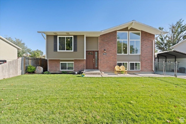 7351 W Zana Ln, Magna, UT 84044 - view of front of house featuring brick siding and a detached carport