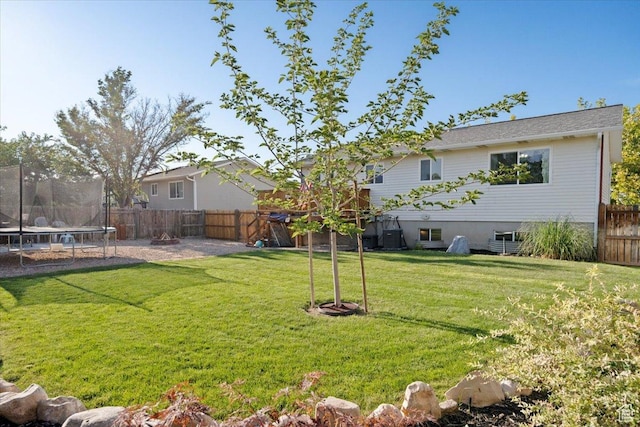 7351 W Zana Ln, Magna, UT 84044 - fenced backyard with a trampoline