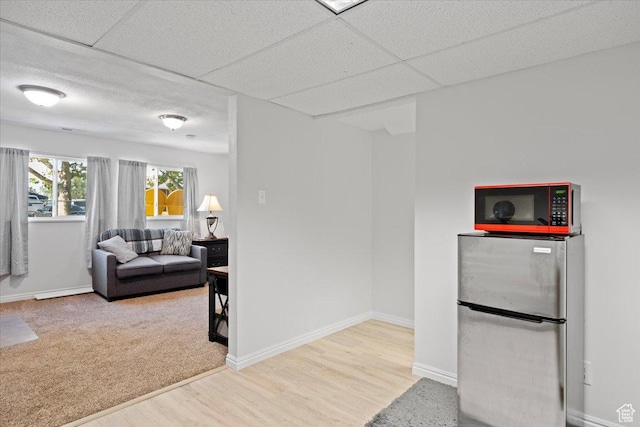 7351 W Zana Ln, Magna, UT 84044 - kitchen featuring freestanding refrigerator and wood finished floors