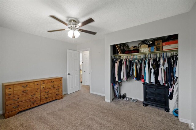 7351 W Zana Ln, Magna, UT 84044 - bedroom featuring a closet, carpet, a textured ceiling, and a ceiling fan