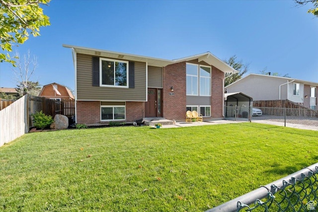 7351 W Zana Ln, Magna, UT 84044 - split foyer home featuring a carport and brick siding