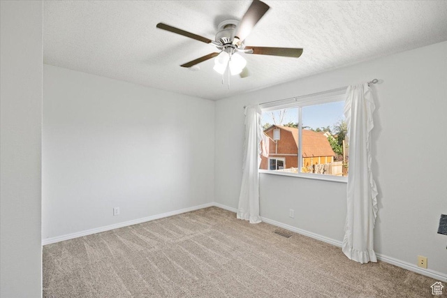 7351 W Zana Ln, Magna, UT 84044 - carpeted spare room featuring a ceiling fan and a textured ceiling