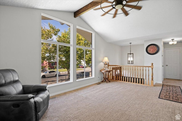 7351 W Zana Ln, Magna, UT 84044 - sitting room featuring a ceiling fan, carpet, a textured ceiling, and an upstairs landing