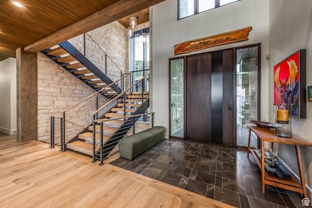 1545 N Red Castle Cir, Heber City, UT 84032 - foyer featuring a wooden ceiling with exposed beams, a high ceiling, stairway, and a chandelier