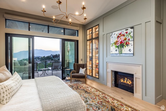 1545 N Red Castle Cir, Heber City, UT 84032 - bedroom with a mountain view, a chandelier, access to exterior, and wood finished floors