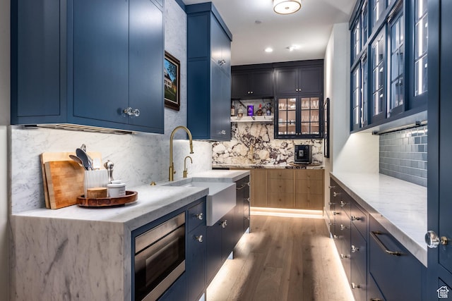 1545 N Red Castle Cir, Heber City, UT 84032 - kitchen featuring blue cabinets, stainless steel microwave, decorative backsplash, and recessed lighting