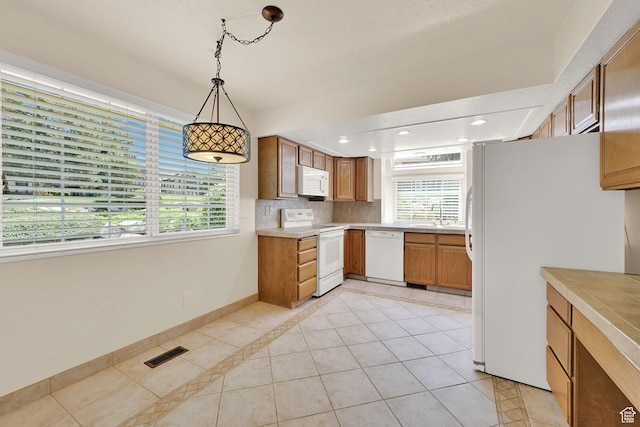 293 E 5450 S Unit 19, Washington Terrace, UT 84405 - kitchen with white appliances, light tile patterned flooring, light countertops, tasteful backsplash, and recessed lighting