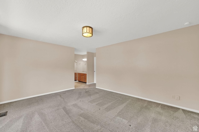 293 E 5450 S Unit 19, Washington Terrace, UT 84405 - spare room featuring light carpet and baseboards