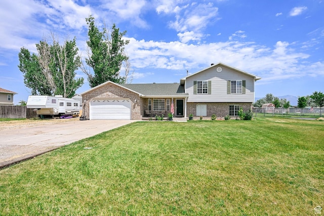 5548 W 4350 S, Hooper, UT 84315 - tri-level home with brick siding, concrete driveway, and an attached garage