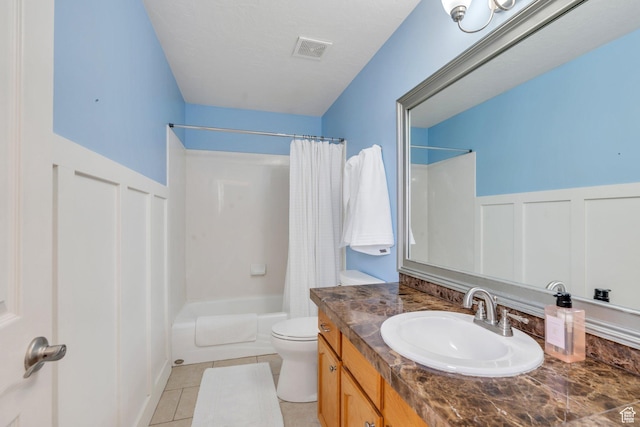 1696 N 2640 W, Lehi, UT 84043 - full bathroom featuring vanity, shower / bath combo with shower curtain, a wainscoted wall, a decorative wall, and tile patterned flooring