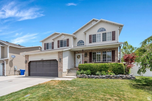 1696 N 2640 W, Lehi, UT 84043 - view of front of home with driveway, a front yard, a porch, and brick siding