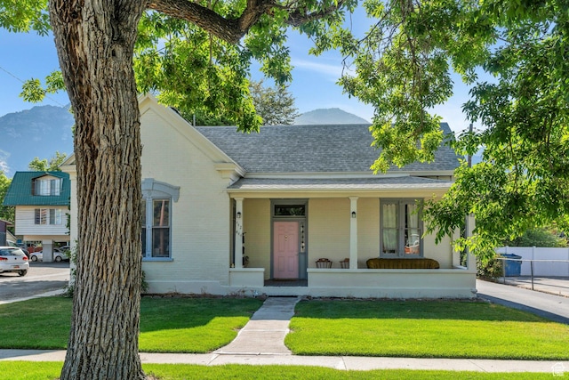 442 N 100 E, Provo, UT 84606 - view of front facade with a shingled roof, a porch, and brick siding