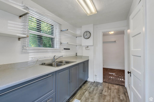 442 N 100 E, Provo, UT 84606 - kitchen with open shelves, light countertops, light wood-type flooring, and blue cabinets