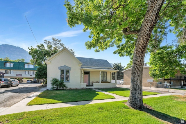 442 N 100 E, Provo, UT 84606 - bungalow featuring a mountain view, uncovered parking, stucco siding, roof with shingles, and a porch