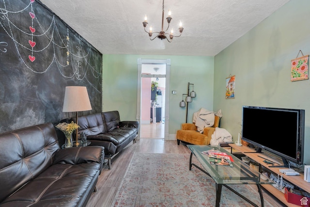 442 N 100 E, Provo, UT 84606 - living room with a textured ceiling, a chandelier, and wood finished floors
