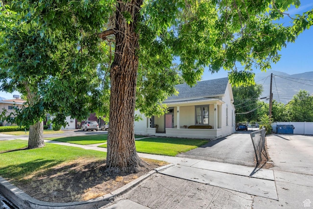 442 N 100 E, Provo, UT 84606 - view of front of house featuring a front yard, a shingled roof, stucco siding, and asphalt driveway