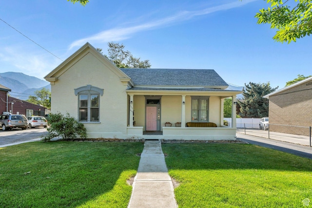442 N 100 E, Provo, UT 84606 - view of front facade with covered porch, brick siding, a shingled roof, and a mountain view