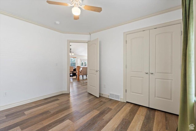 1827 E 1530 S, Spanish Fork, UT 84660 - unfurnished bedroom featuring wood finished floors, ornamental molding, a ceiling fan, and a closet