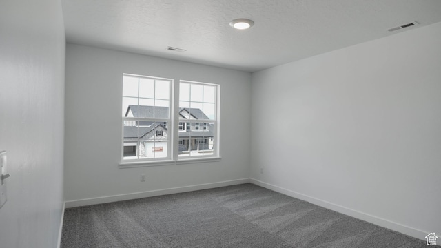 903 W Fallow Dr Unit 212, Saratoga Springs, UT 84045 - carpeted empty room with baseboards and a textured ceiling