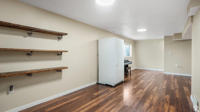 285 W 90 N, Clearfield, UT 84015 - unfurnished living room featuring dark wood-style floors and baseboards