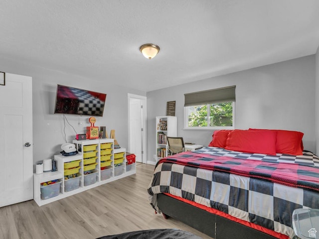 4273 W Annapolis Dr S, West Valley City, UT 84120 - bedroom with wood finished floors and a textured ceiling