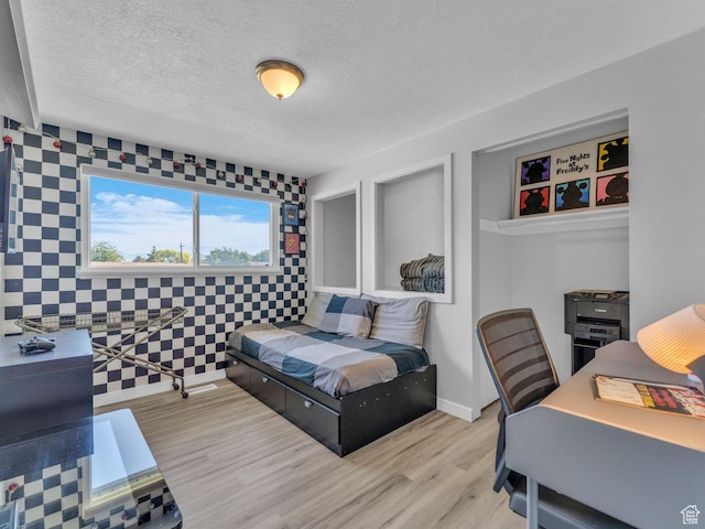 4273 W Annapolis Dr S, West Valley City, UT 84120 - bedroom with wood finished floors and a textured ceiling